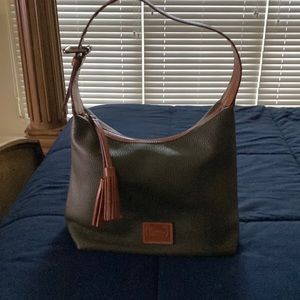 This bad is dark green with red interior, it has an adjustable strap